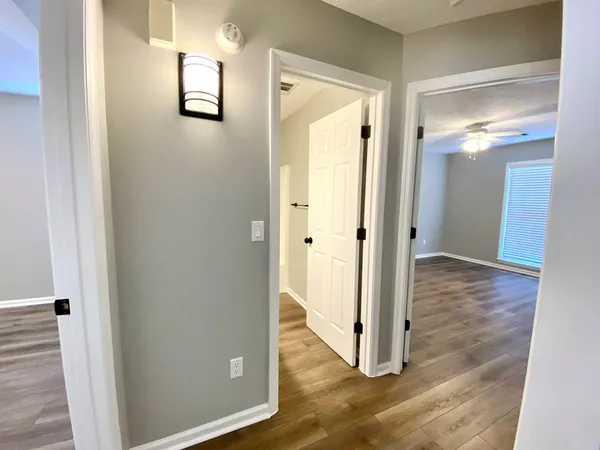 a view of a bathroom from a hallway