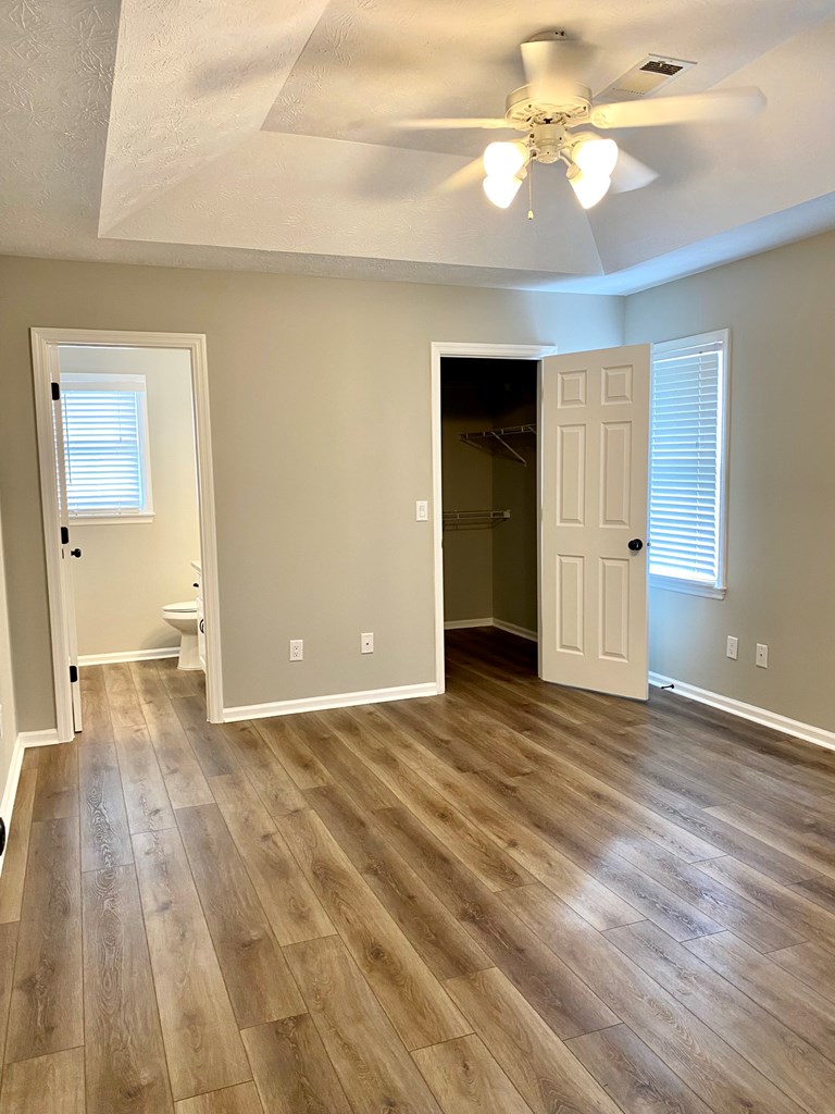 6032 North Pointe Drive Columbus, GA 31909 - Photo 13 of 26 a view of an empty room with window and wooden floor