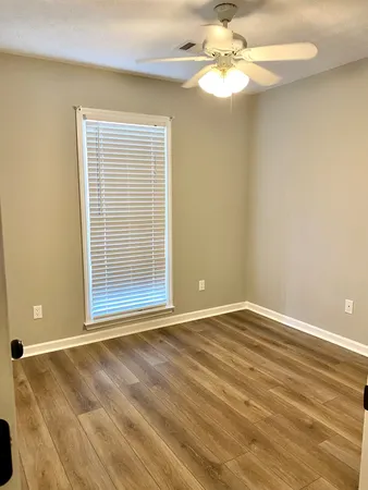 a view of an empty room with a window