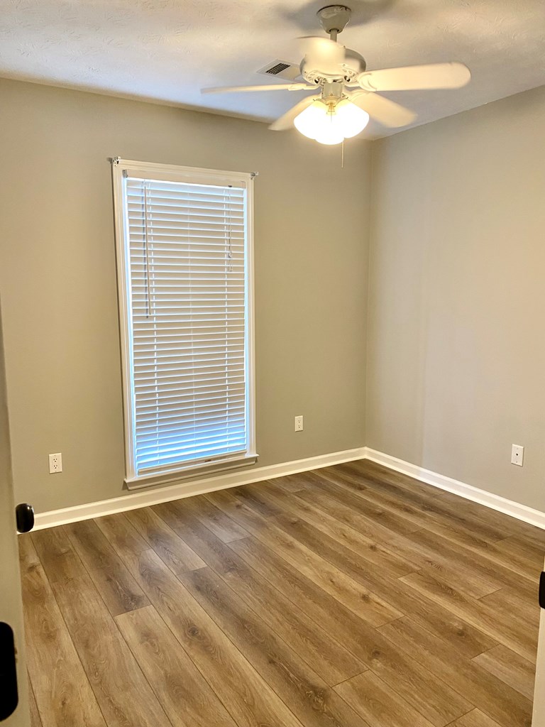 6032 North Pointe Drive Columbus, GA 31909 - Photo 19 of 26 a view of an empty room with a window