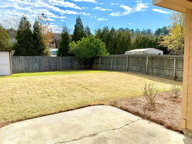 a view of a swimming pool with a backyard