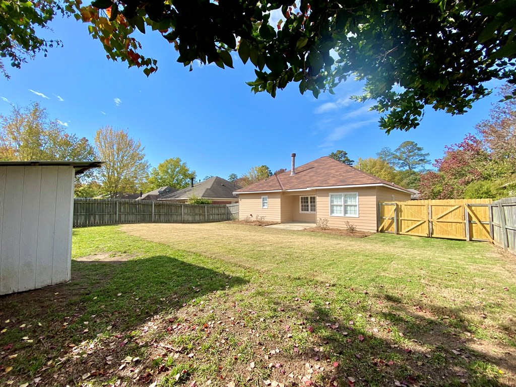 6032 North Pointe Drive Columbus, GA 31909 - Photo 25 of 26 a view of a house with a yard