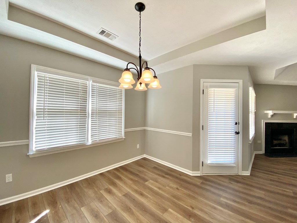 6032 North Pointe Drive Columbus, GA 31909 - Photo 10 of 26 a view of empty room with wooden floor and fan