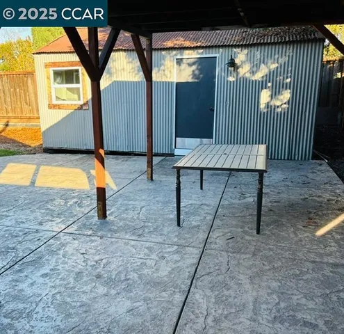 a utility room with lots of wooden cabinets