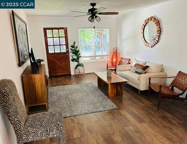 a living room with furniture rug and window