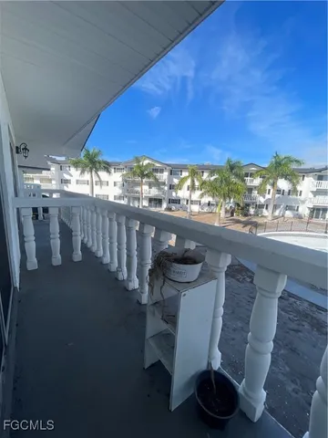 a view of a chairs and table in the patio