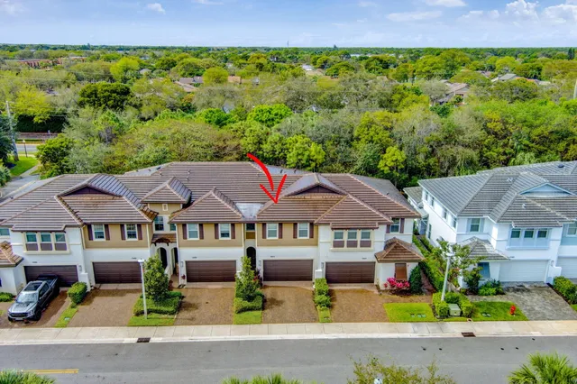 an aerial view of residential houses with outdoor space