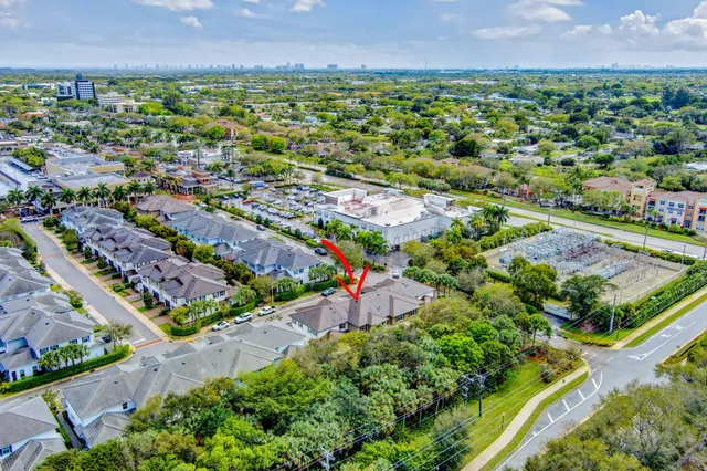 a living room with furniture and a view of kitchen