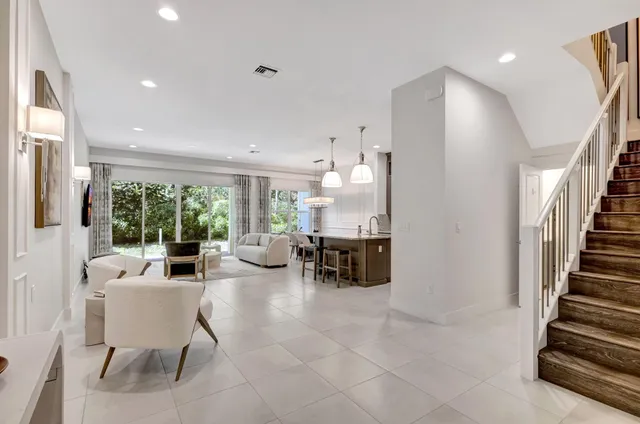 a front view of a house with a yard and a garage