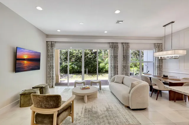 a front view of a house with a yard and a garage