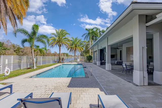 a bathroom with a granite countertop sink mirror and toilet
