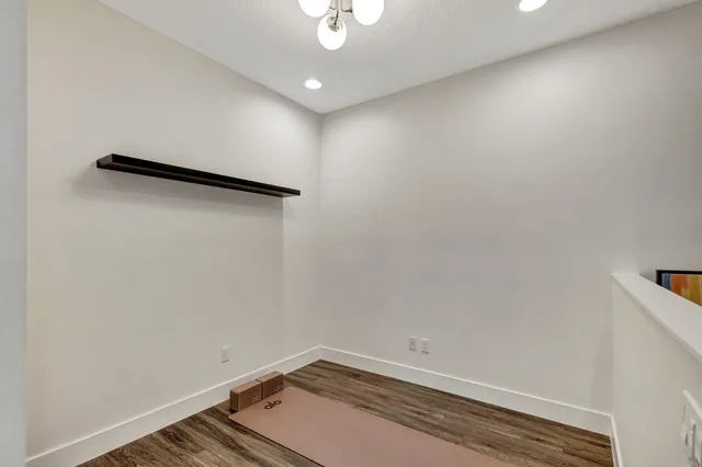 a bedroom with a bed and a chair