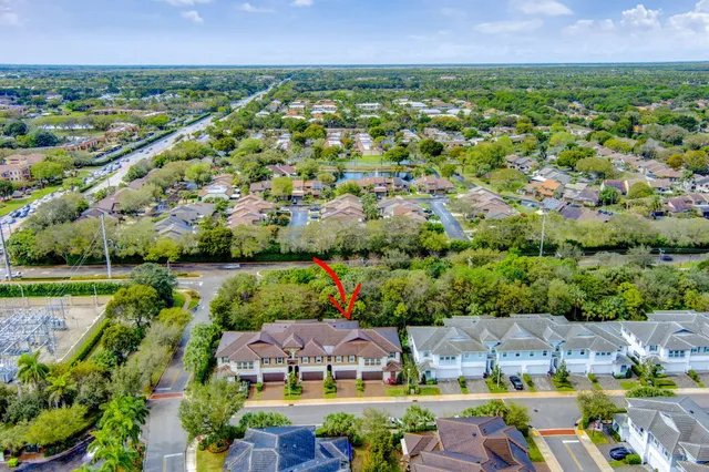 a bedroom with a bed and a flat tv screen on dresser
