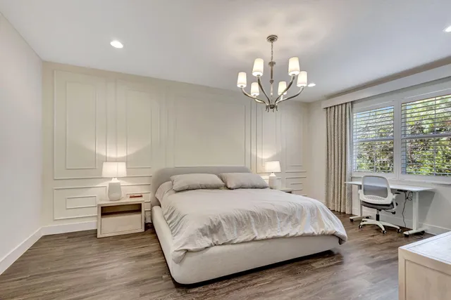 an aerial view of residential houses with outdoor space and street view