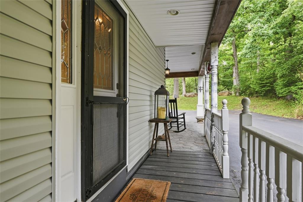 5380 Hardt Road Gibsonia, PA 15044 - Photo 8 of 49 The wrap around porch with its rustic farmhouse pillars leads to a 2nd side entry to the house.