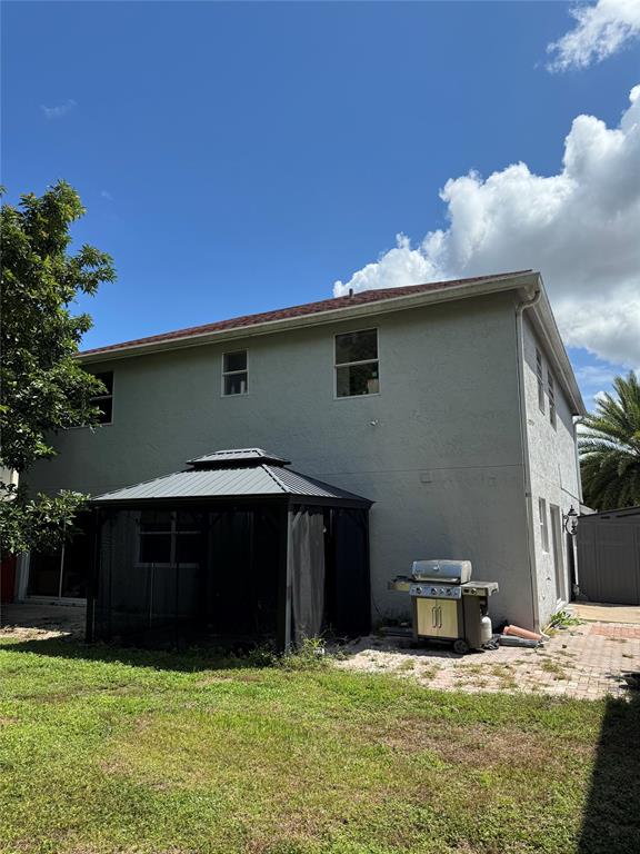 22251 Sands Point Drive Boca Raton, FL 33433 - Photo 2 of 41 a house view with a garden space