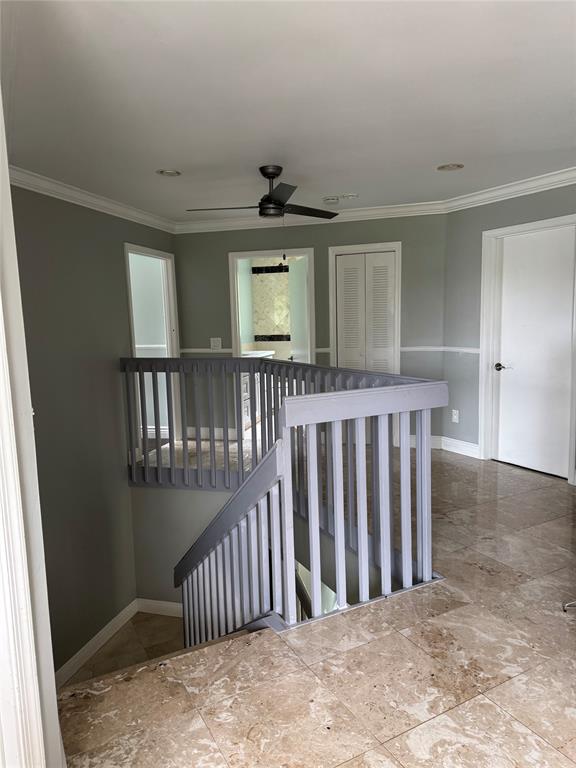 22251 Sands Point Drive Boca Raton, FL 33433 - Photo 23 of 41 a view of staircase with wooden floor and a window