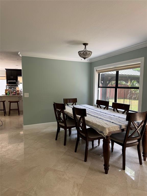 22251 Sands Point Drive Boca Raton, FL 33433 - Photo 31 of 41 a view of a dining room with furniture window and outside view