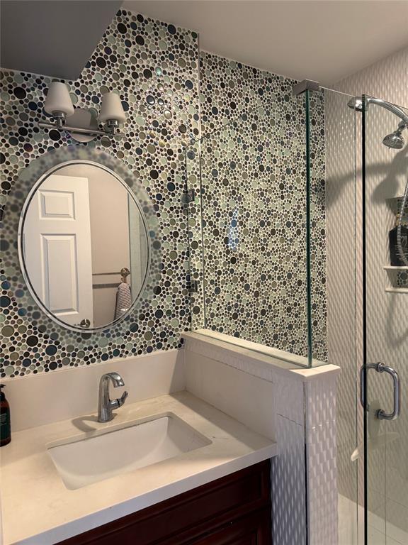 22251 Sands Point Drive Boca Raton, FL 33433 - Photo 38 of 41 a bathroom with a sink and a mirror