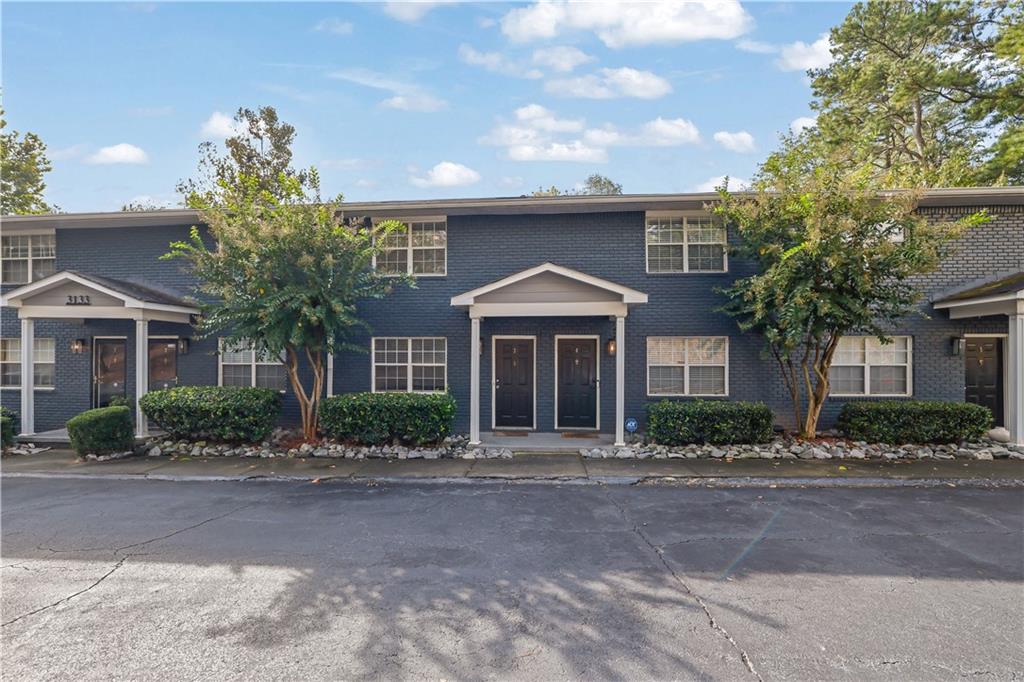 3133 Buford Highway Northeast, Unit 3 Brookhaven, GA 30329 - Photo 1 of 36 a front view of a house with garden