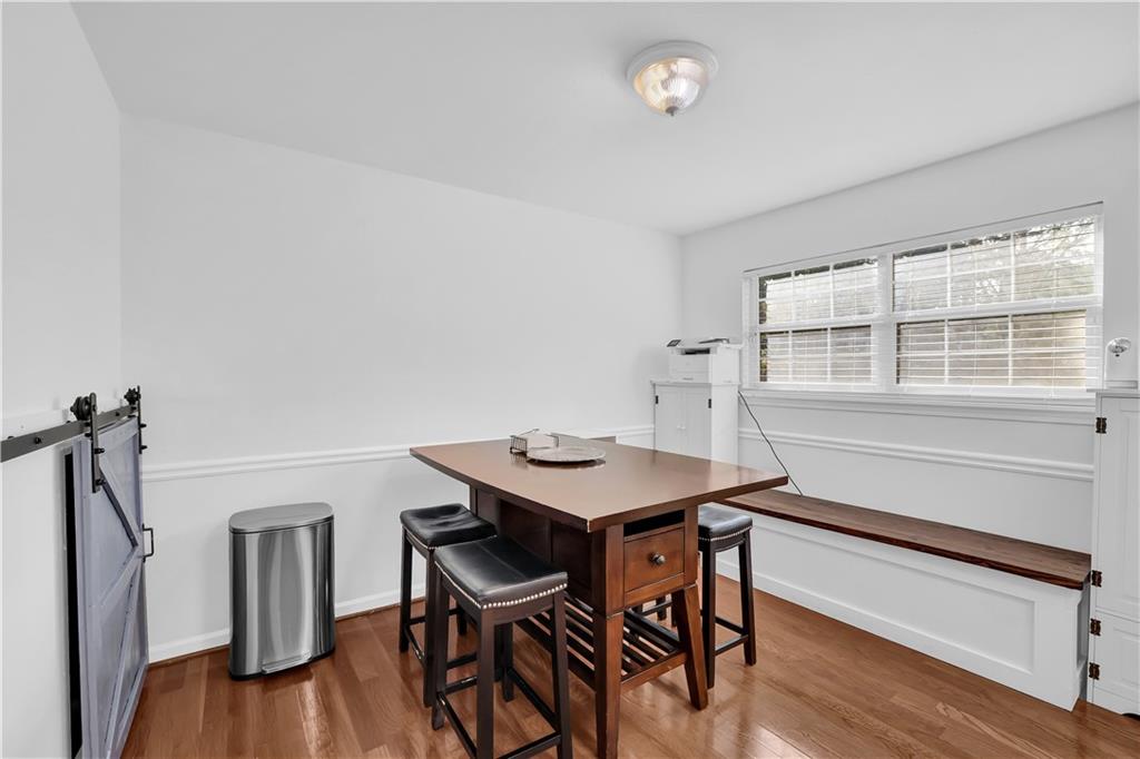 3133 Buford Highway Northeast, Unit 3 Brookhaven, GA 30329 - Photo 13 of 36 a view of a room that has a table and chairs in it