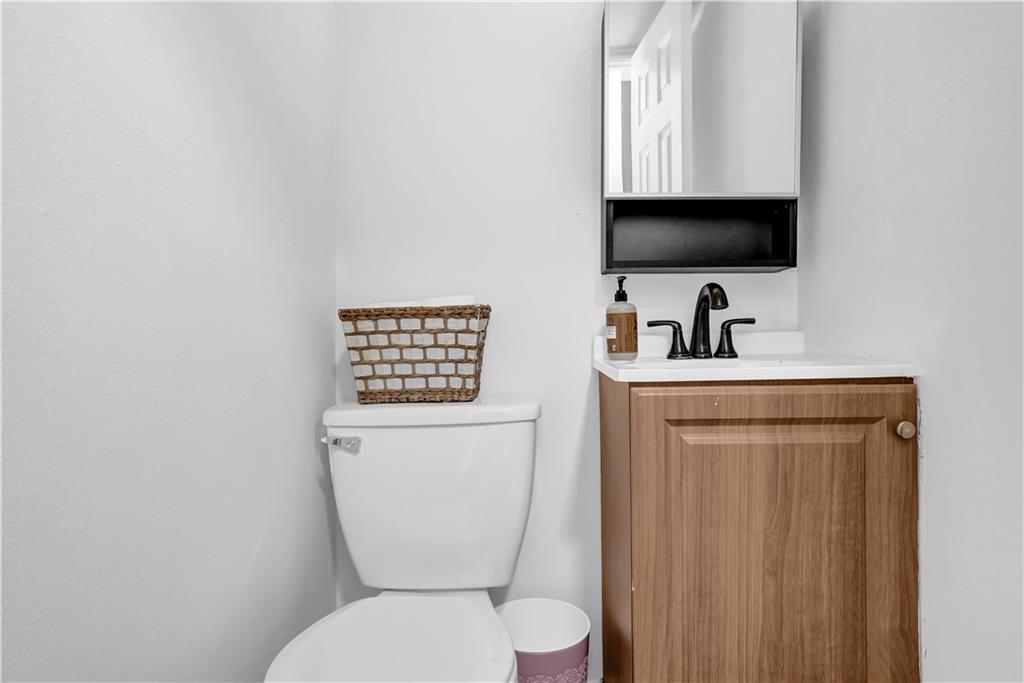 3133 Buford Highway Northeast, Unit 3 Brookhaven, GA 30329 - Photo 17 of 36 a bathroom with a toilet sink and mirror