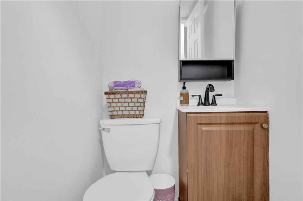 3133 Buford Highway Northeast, Unit 3 Brookhaven, GA 30329 - Photo 18 of 36 a bathroom with a toilet sink and mirror