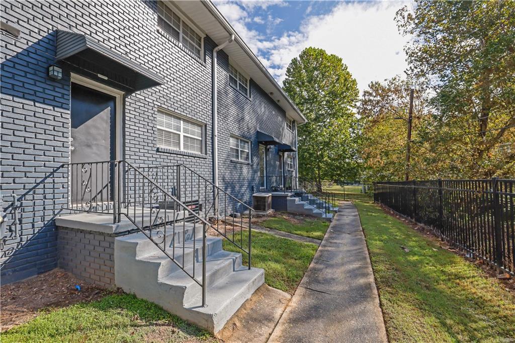 3133 Buford Highway Northeast, Unit 3 Brookhaven, GA 30329 - Photo 27 of 36 a view of a patio with couches table and chairs and potted plants