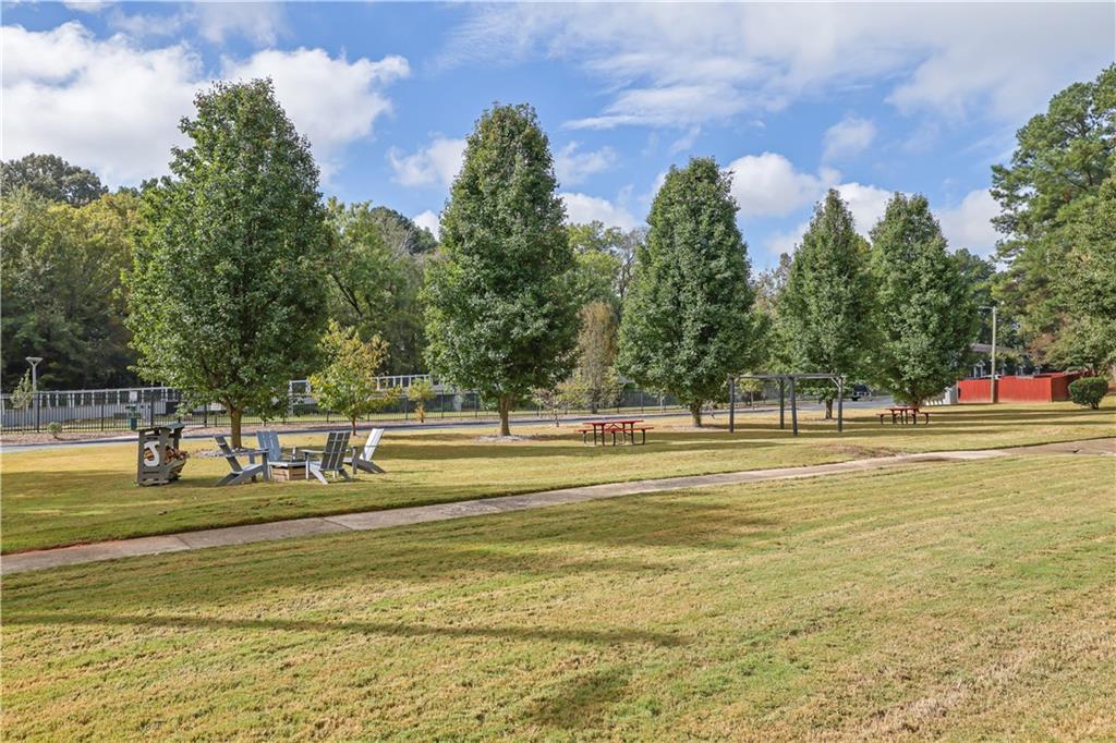 3133 Buford Highway Northeast, Unit 3 Brookhaven, GA 30329 - Photo 28 of 36 a view of a swimming pool with an outdoor space and seating area