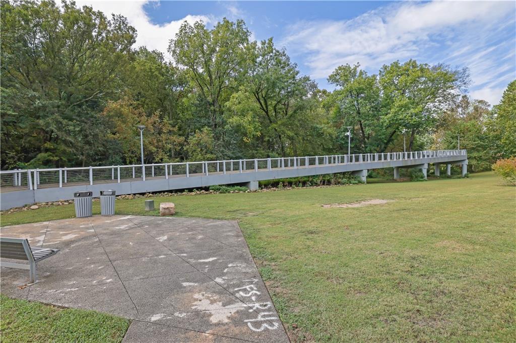 3133 Buford Highway Northeast, Unit 3 Brookhaven, GA 30329 - Photo 32 of 36 a view of a swimming pool with a patio and a yard