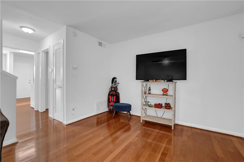 3133 Buford Highway Northeast, Unit 3 Brookhaven, GA 30329 - Photo 6 of 36 a room with furniture and flat screen tv