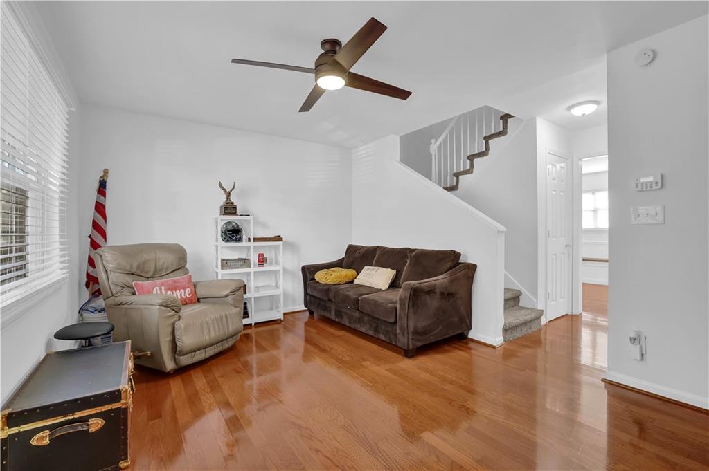 3133 Buford Highway Northeast, Unit 3 Brookhaven, GA 30329 - Photo 8 of 36 a living room with furniture and a ceiling fan