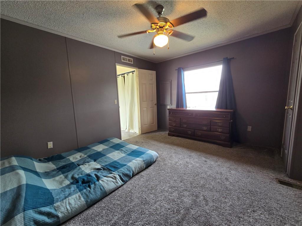 540 Finks Run Road McDonald, PA 15057 - Photo 19 of 39 a bedroom with a bed and a ceiling fan