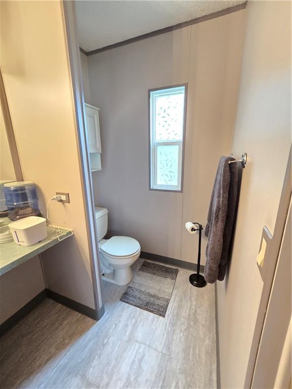 540 Finks Run Road McDonald, PA 15057 - Photo 21 of 39 a bathroom with a sink toilet and a window