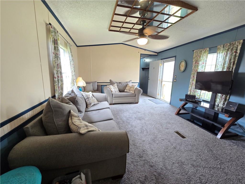 540 Finks Run Road McDonald, PA 15057 - Photo 6 of 39 a living room with furniture a chandelier and a flat screen tv