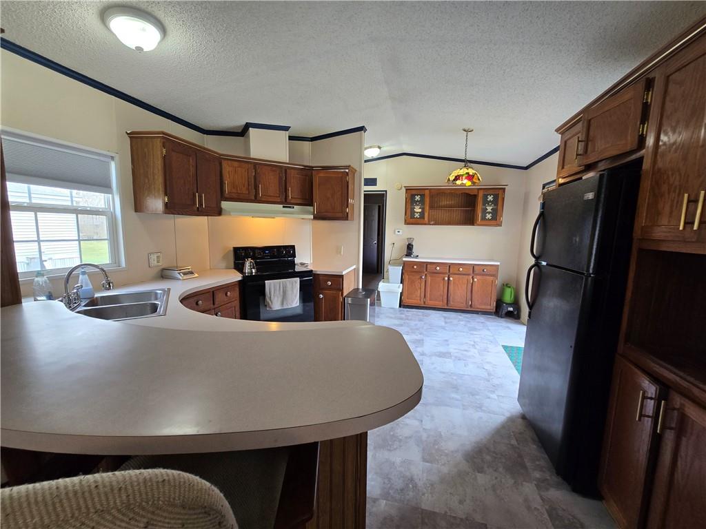 540 Finks Run Road McDonald, PA 15057 - Photo 10 of 39 a living room with a couch and a refrigerator