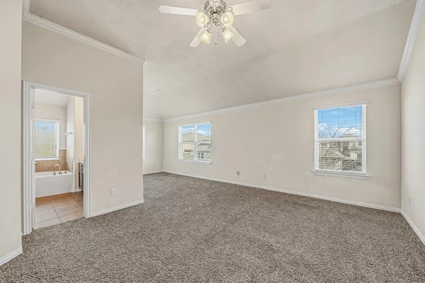 a view of an empty room with a window