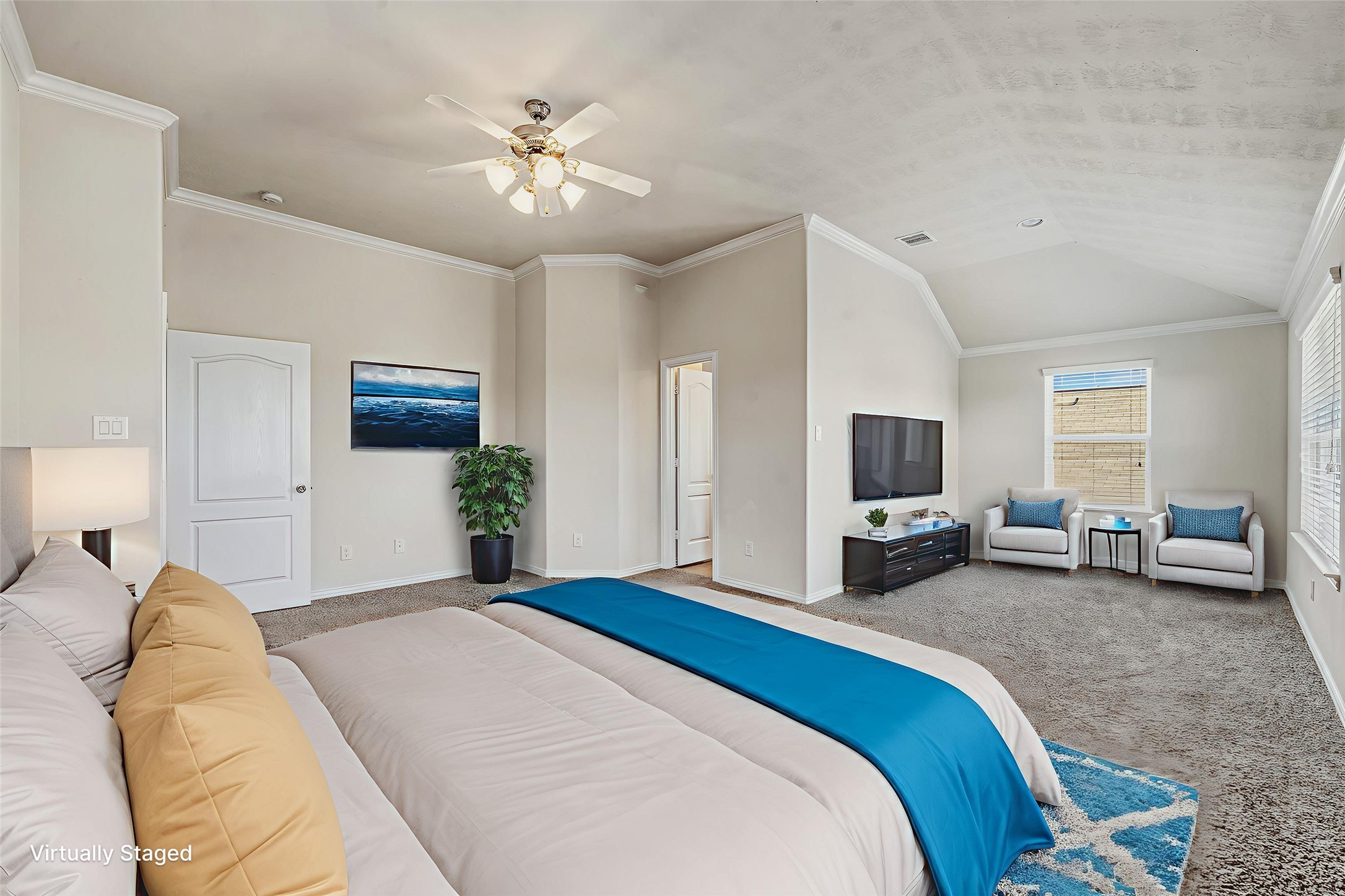 22922 Jetty Manor Lane Spring, TX 77373 - Photo 18 of 46 a bedroom with bed a flat tv screen and a chandelier