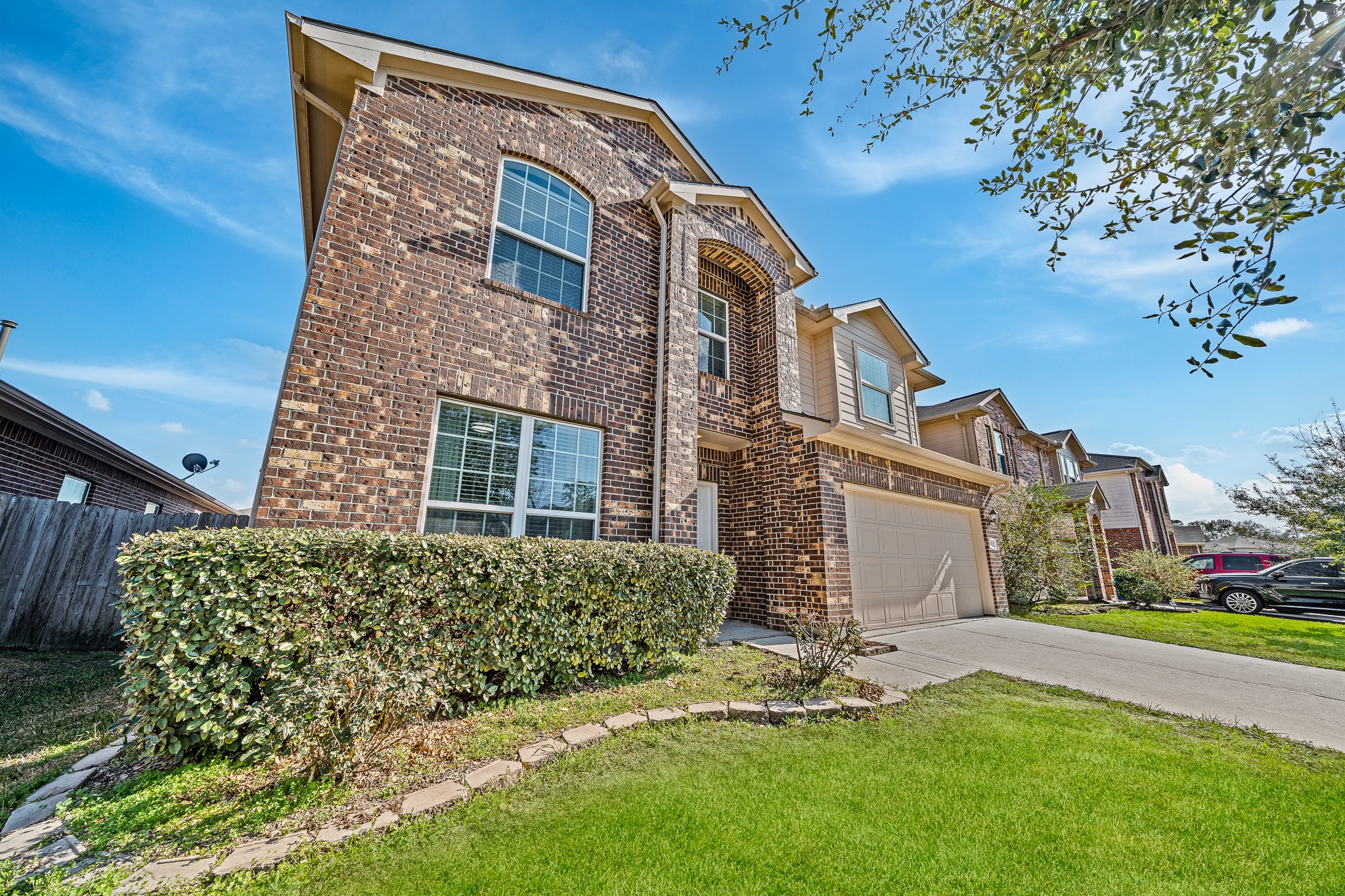 22922 Jetty Manor Lane Spring, TX 77373 - Photo 2 of 46 a front view of a house with a garden