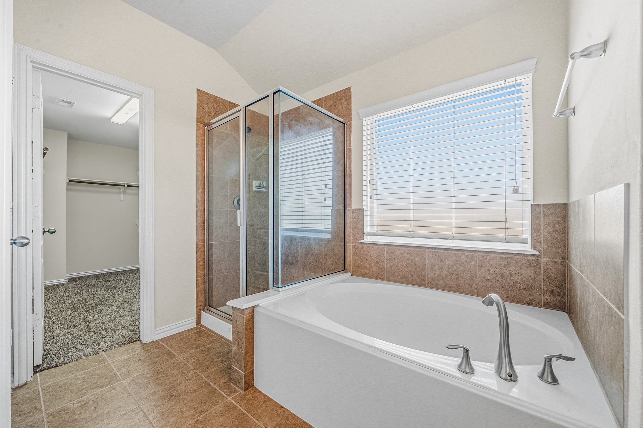 22922 Jetty Manor Lane Spring, TX 77373 - Photo 24 of 46 a bathroom with a bathtub and a shower