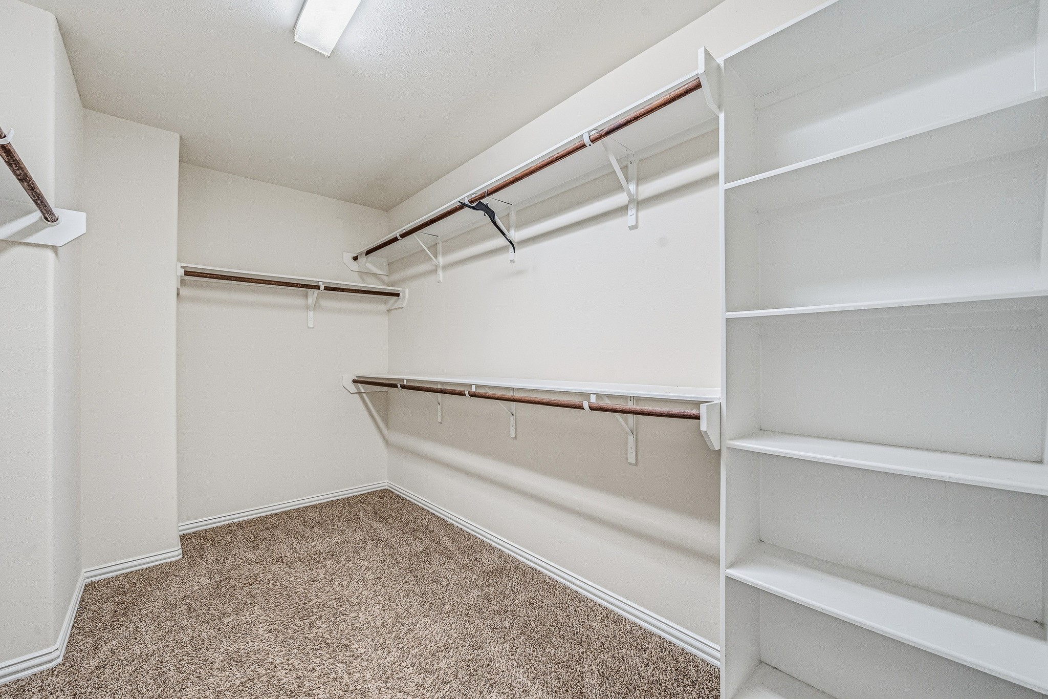 22922 Jetty Manor Lane Spring, TX 77373 - Photo 25 of 46 a view of an empty walk in closet