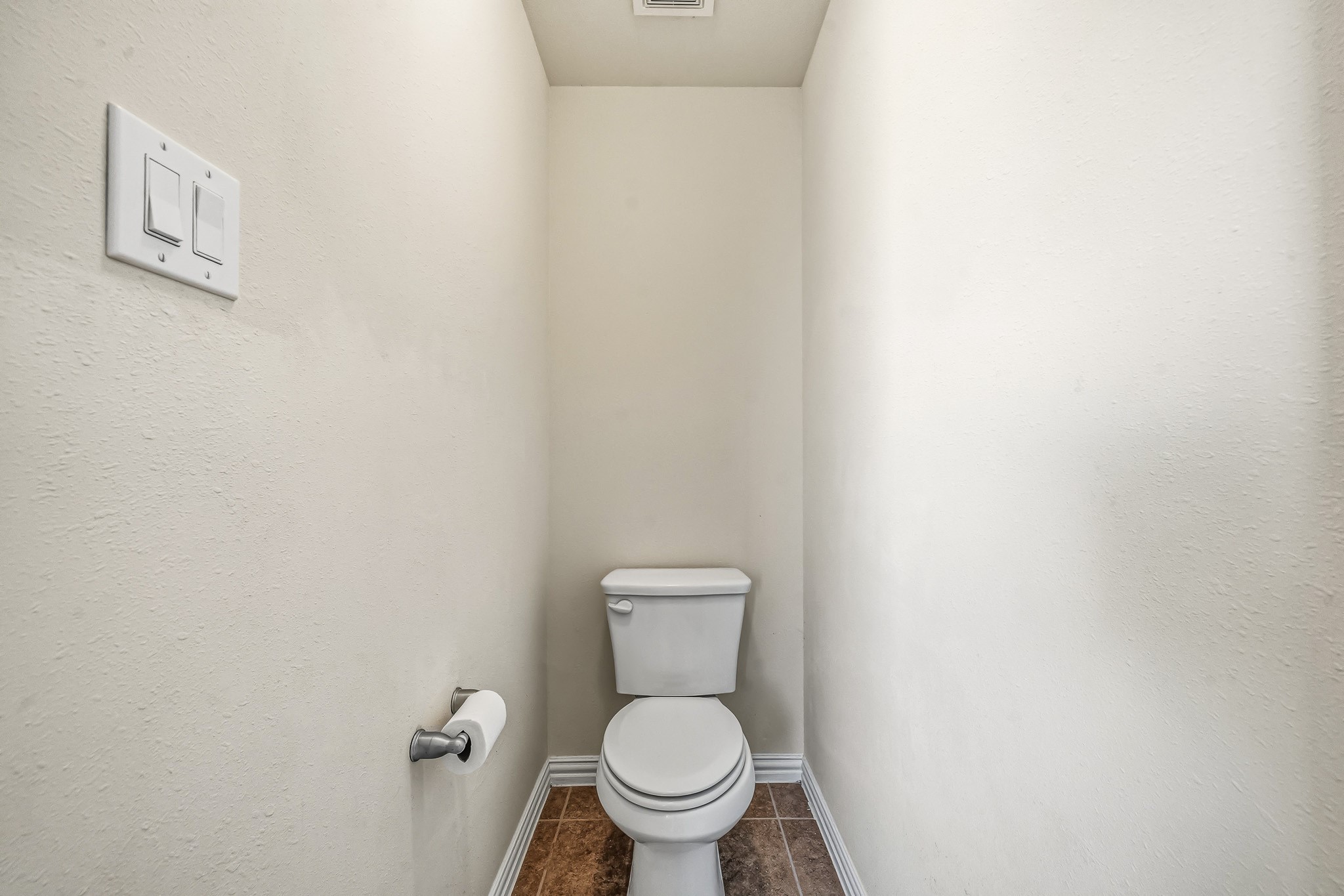 22922 Jetty Manor Lane Spring, TX 77373 - Photo 26 of 46 a white toilet sitting next to a small bathroom