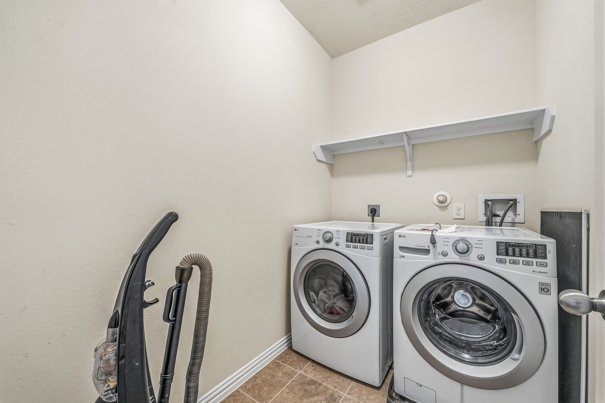 22922 Jetty Manor Lane Spring, TX 77373 - Photo 27 of 46 a utility room with dryer and washer