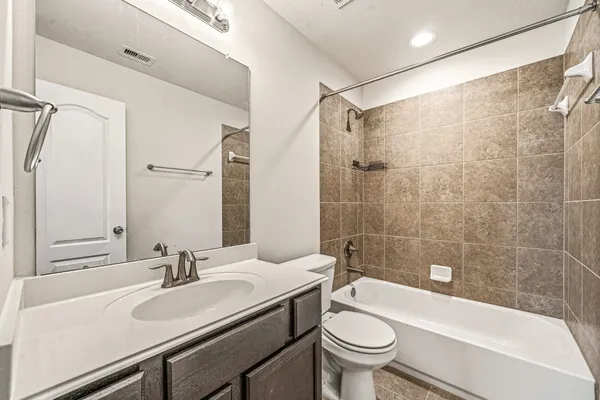 a bathroom with a sink a toilet and a bathtub