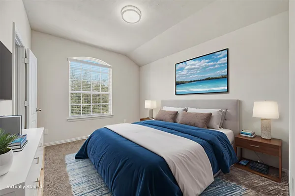 a bedroom with bed and window