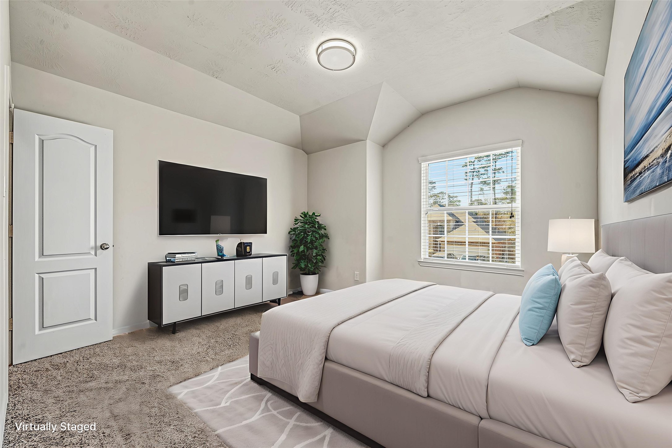 22922 Jetty Manor Lane Spring, TX 77373 - Photo 36 of 46 a bedroom with a flat screen television and a bed