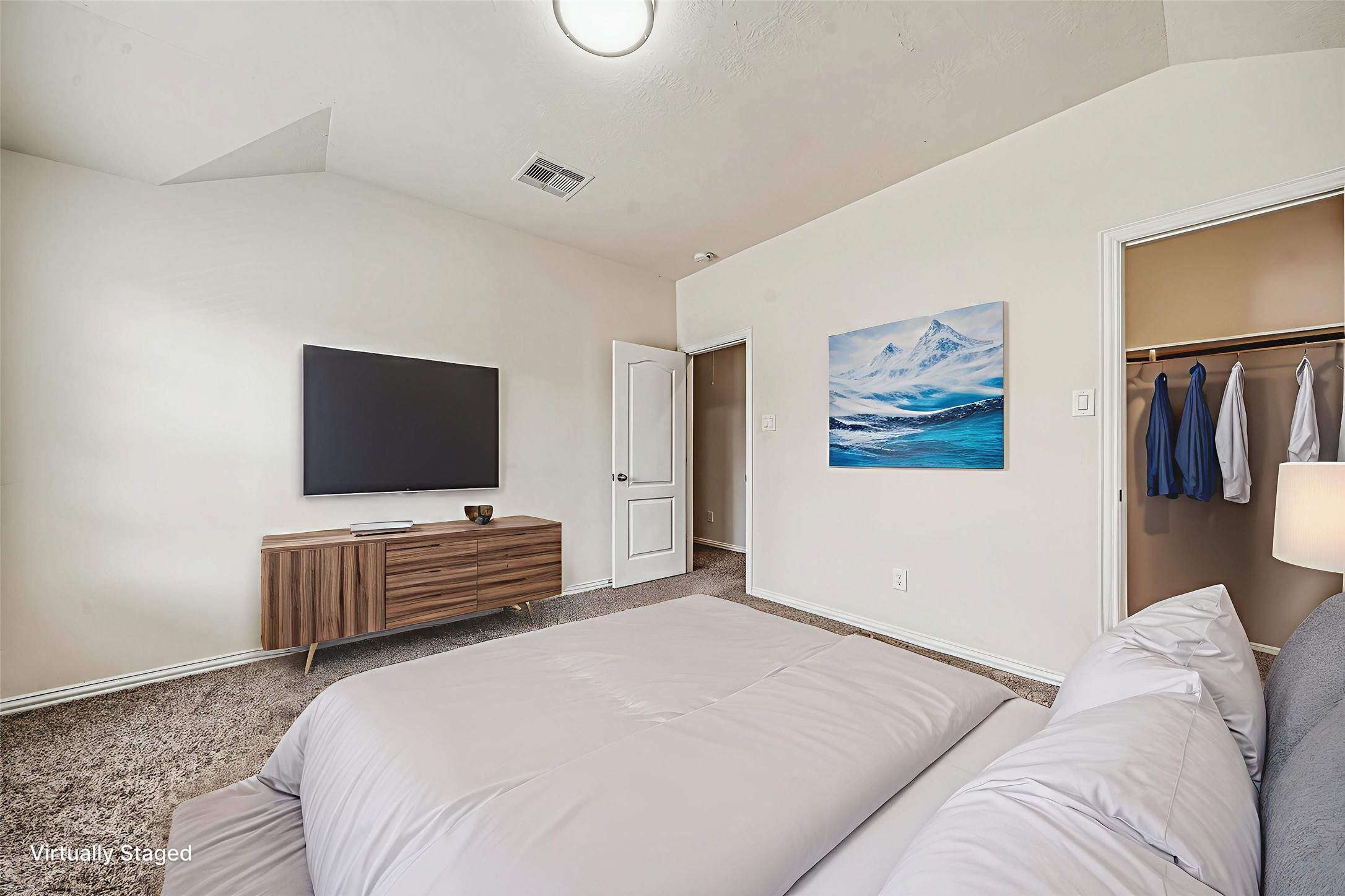 22922 Jetty Manor Lane Spring, TX 77373 - Photo 38 of 46 a bedroom with a bed and a flat screen tv