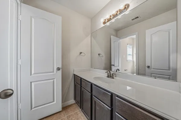 a white toilet sitting next to a bath tub