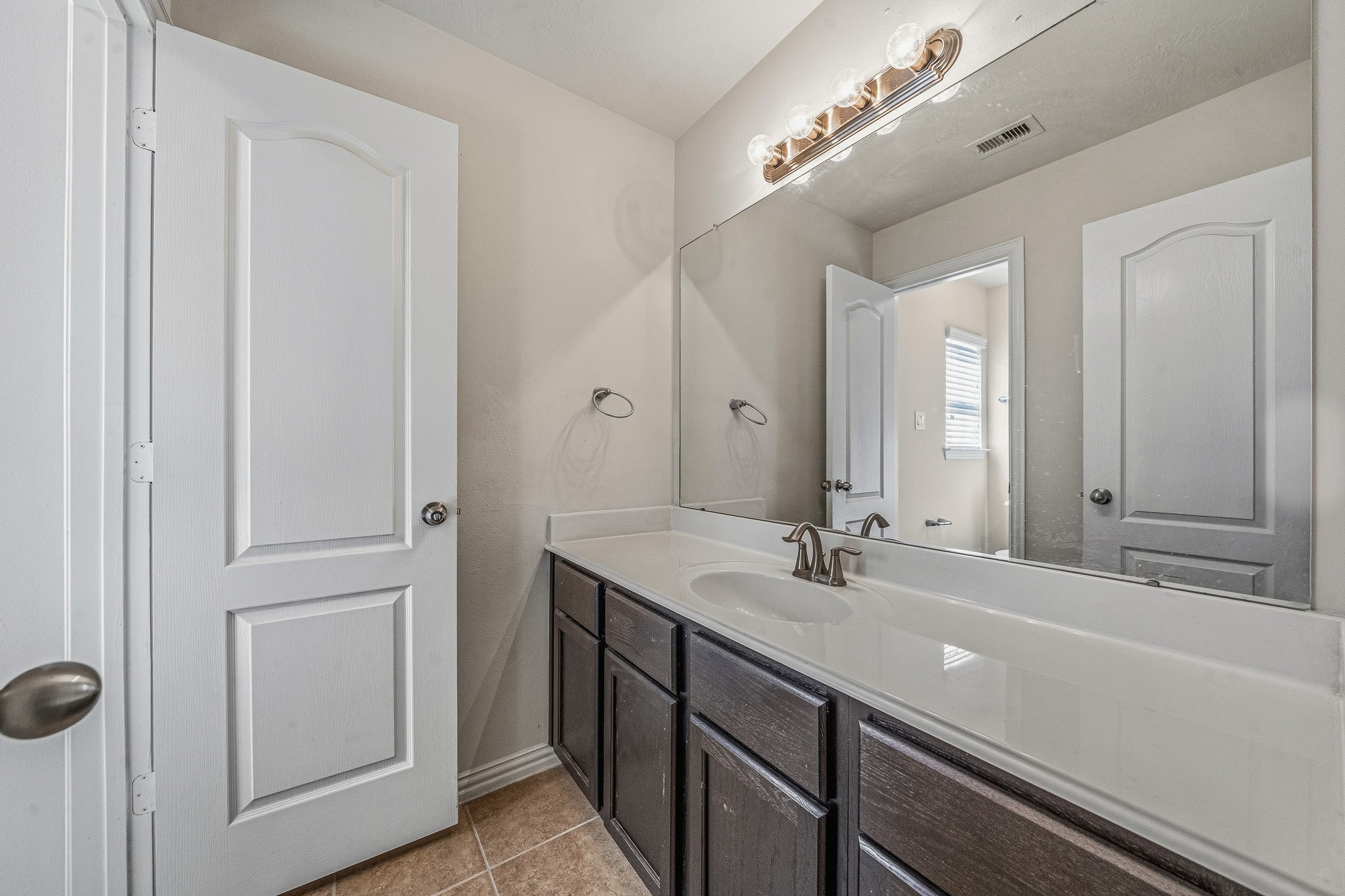 22922 Jetty Manor Lane Spring, TX 77373 - Photo 41 of 46 a bathroom with a sink and a mirror