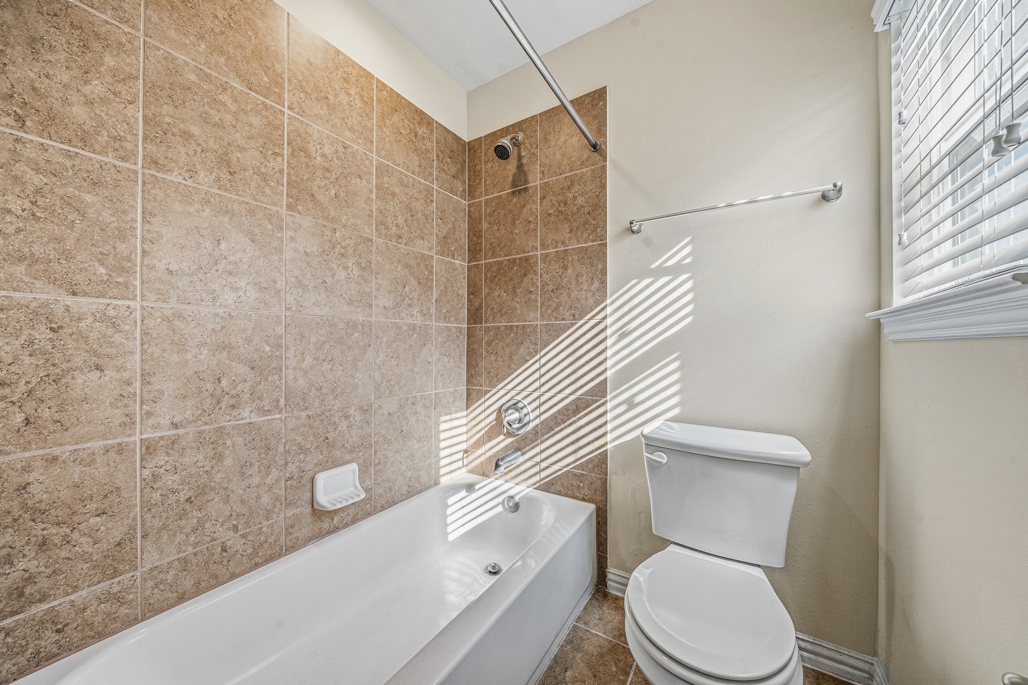 22922 Jetty Manor Lane Spring, TX 77373 - Photo 42 of 46 a white toilet sitting next to a bath tub